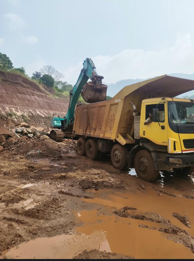 Excavator and tipper on earthwork site