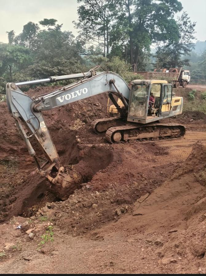 Volvo excavator on earthwork site, Odisha