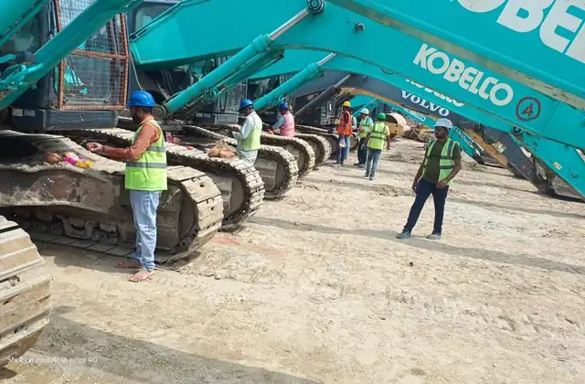Excavators lined up at site
